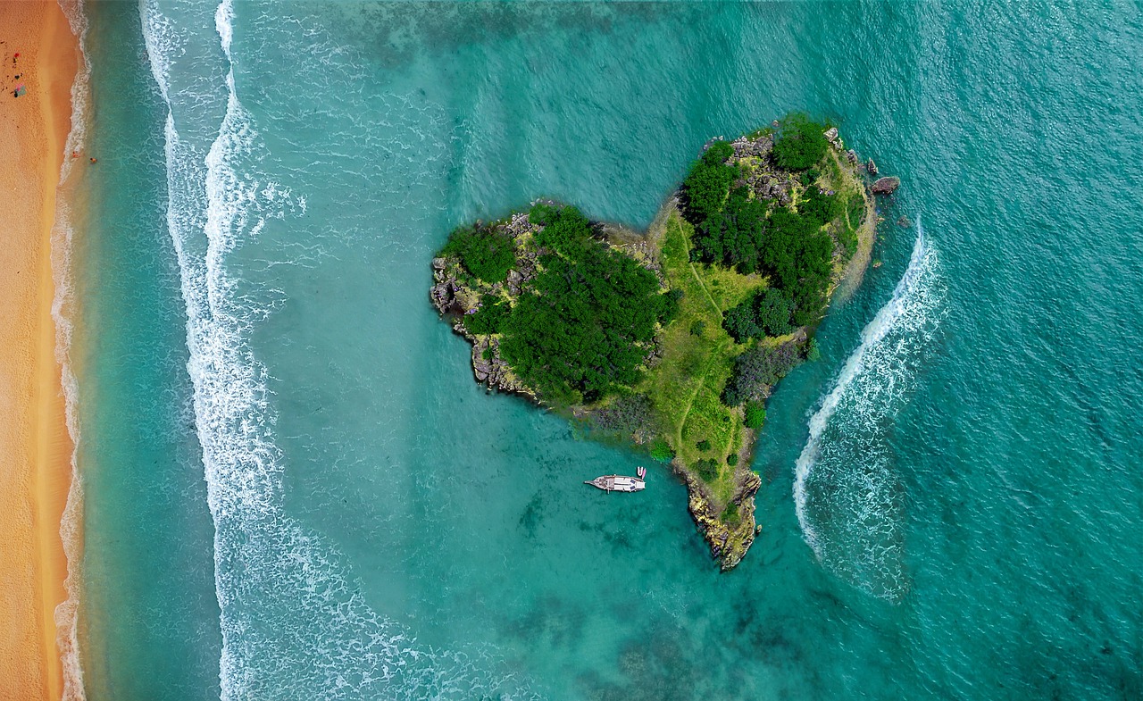 Aerial view of a tropical island lagoon with bright blue water