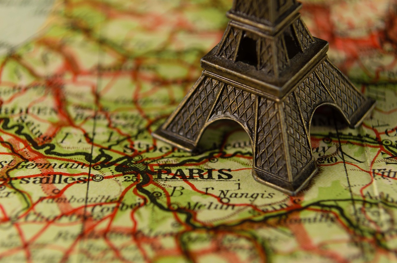 Paris street scene with classic buildings and a view toward the Eiffel Tower