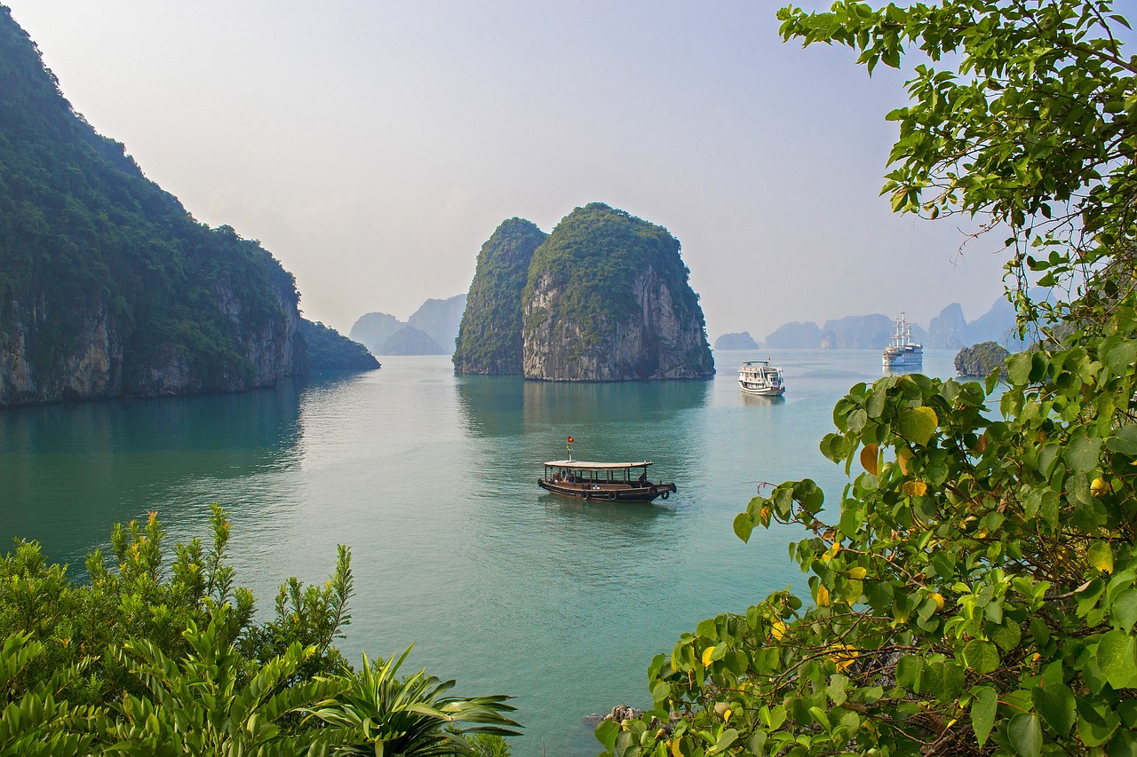 Scenic bay in Vietnam with boats and limestone cliffs